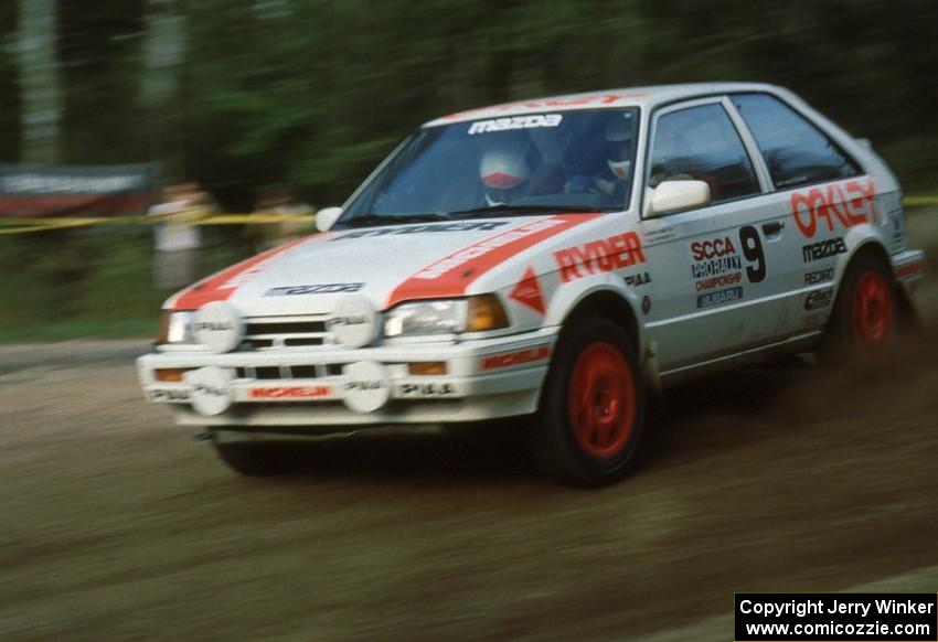 Jeff Zwart / Cal Coatsworth Mazda 323GTX dive downward through the crossroads.