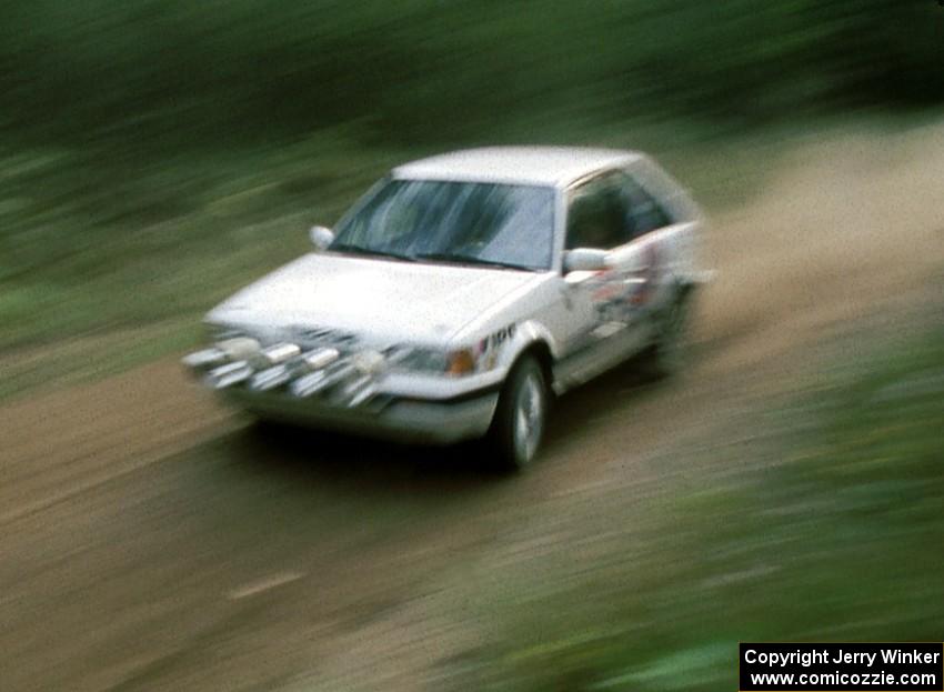 Michael Grieb / Ernest Carpenter blast by in their PGT Mazda 323GTX.