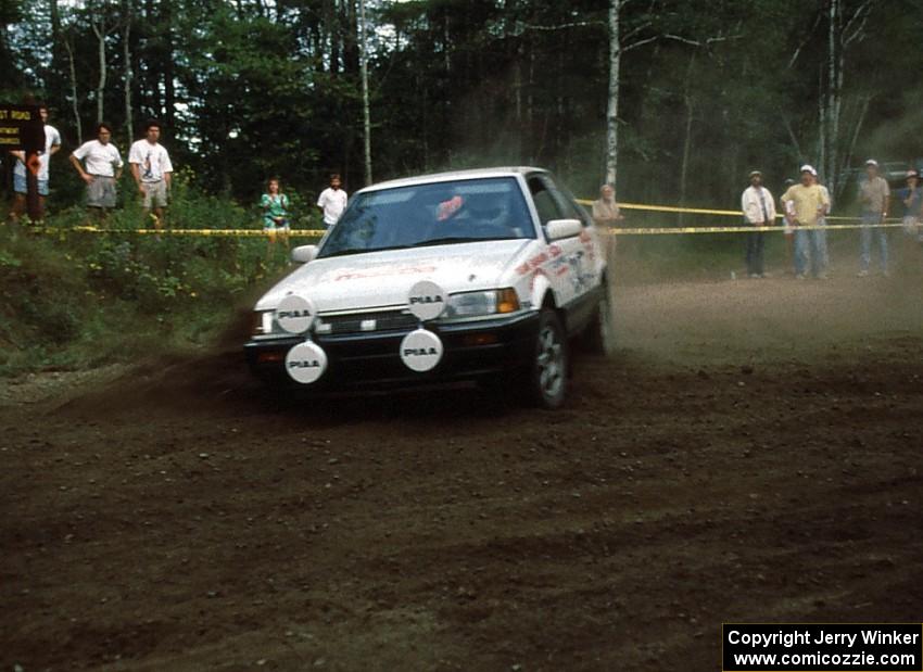 Staurt Sarasin / Joyce Sarasin slide to a halt in their Mazda 323GTX. They recovered to take second in the Paul Bunyan's Ride.