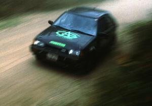 Tom Ottey / Pam McGarvey blast past en route to a class win in their PGT Mazda 323GTX.