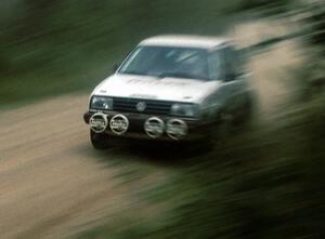 Frank Cunningham / Charles Bradley rocket past in their Gr.A VW GTI.