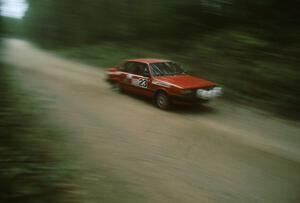 Jon Kemp / Gail McGuire in their Audi 4000 Quattro rocket down a straight.