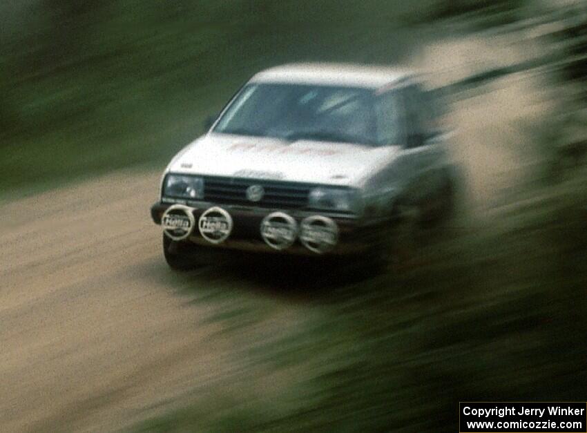 Frank Cunningham / Charles Bradley rocket past in their Gr.A VW GTI.