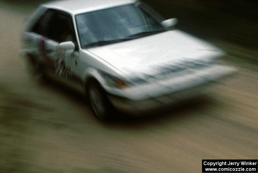 Michael Grieb / Bob Martin rocket by in their PGT Mazda 323GTX.