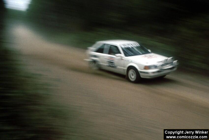 Barry Beal, Jr. / Jim Gill in their PGT Mazda 323GTX.