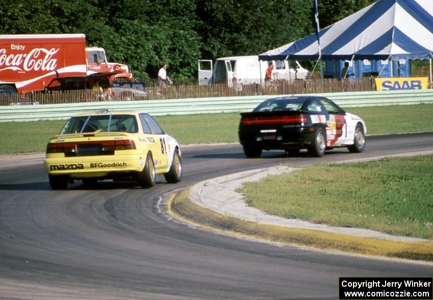 Mike Rutherford's Mitsubishi Eclipse and Dave Jolly's Mazda MX-6 GT Turbo