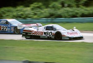 Jan Lammers / Price Cobb Jaguar XJR-10 passes the Lance Stewart / John Overton Mazda RX-7 (GTU)