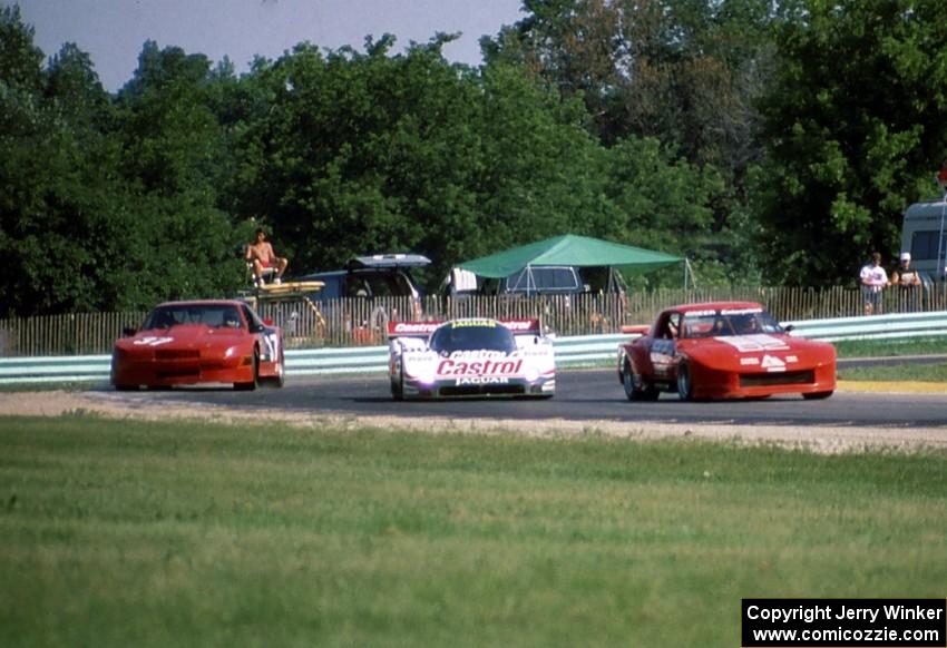 Three cars come out or corner 8 during practice