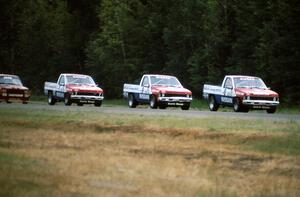 8) Ray Kong leads 9) Scott Gaylord, 7) Pepe Pombo all in Nissan Pickups
