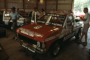 The Spencer Low Racing Nissan Pickups in the tech shed 8) Ray Kong, 7) Pepe Pombo and 9) Scott Gaylord