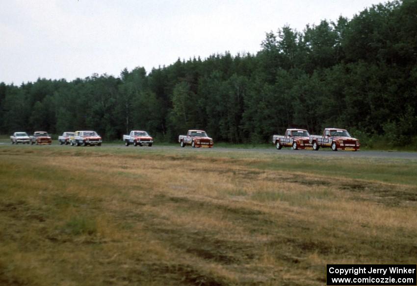 The field streams into corner 3 on the first lap