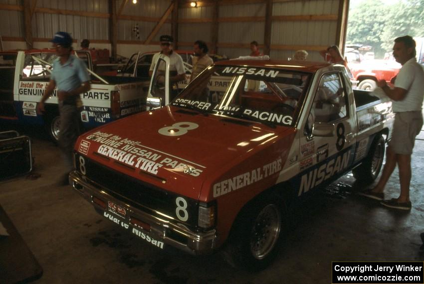 The Spencer Low Racing Nissan Pickups in the tech shed 8) Ray Kong, 7) Pepe Pombo and 9) Scott Gaylord