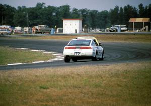 John Schneider / Ron Nelson Nissan 300ZX Turbo chases two other cars into turn 4