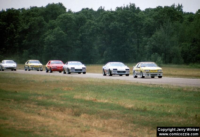 The leaders come into turn 4 on the first lap