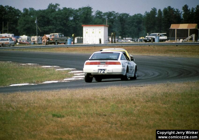John Schneider / Ron Nelson Nissan 300ZX Turbo chases two other cars into turn 4