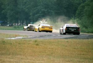 Robert Lappalainen's Ford Mustang is chased by Les Lindley's Chevy Camaro and Dick Danielson's Olds Cutlass Supreme
