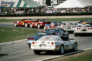 Chevy Corvettes battle into turn 5