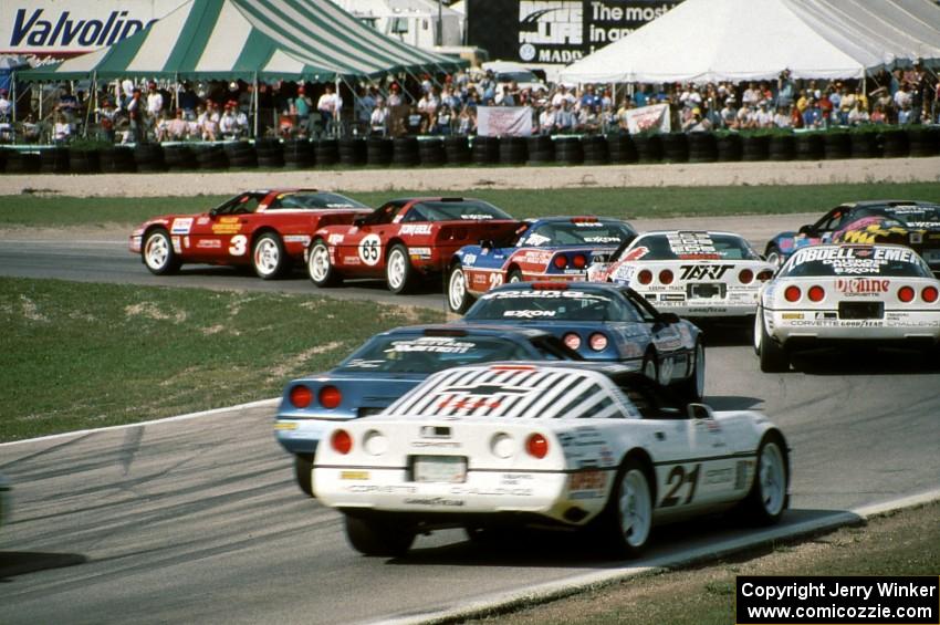 Chevy Corvettes battle into turn 5