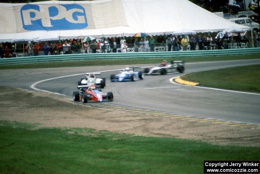Robbie Groff, Mark Smith, Harald Huysman and Jeff Davis all in Ralt RT-5s, on lap one.