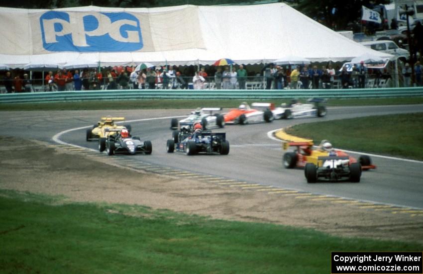 Cars spinning at turn 5 in the rain.