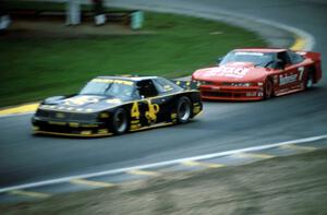 Robert Lappalainen's Ford Mustang and Paul Gentilozzi's Olds Cutlass Supreme