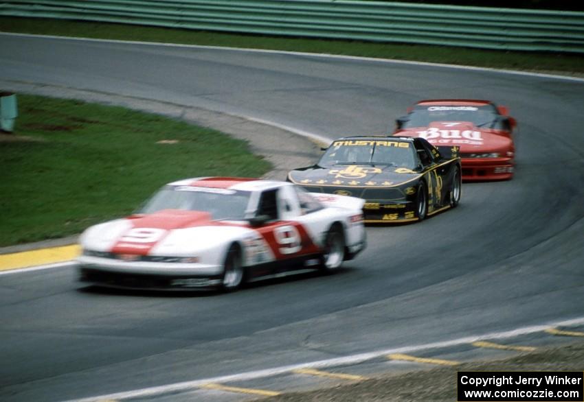 Dick Danielson's Olds Cutlass Supreme ahead of Robert Lappalainen's Ford Mustang and Paul Gentilozzi's Olds Cutlass Supreme