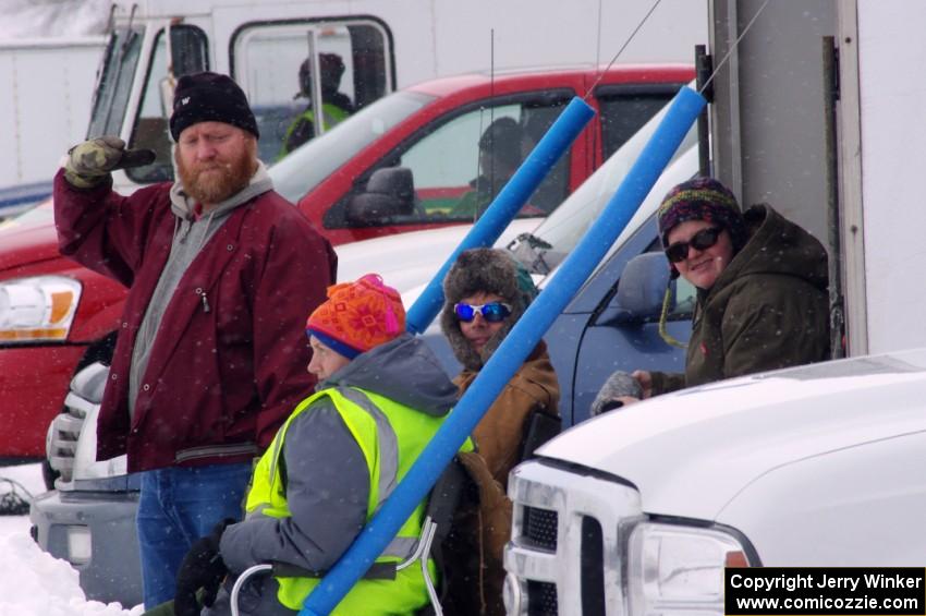 Team Mayhem tries to keep warm in the pits