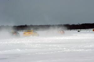 The field heads into turn two under bad whiteout conditions.