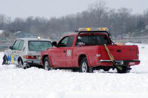 Jim Anderson's Dodge Ram Pickup tries to get the stranded Bucky Weitnauer VW Rabbit off the bank.