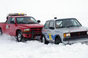 Jim Anderson's Dodge Ram Pickup tries to get the stranded Bucky Weitnauer VW Rabbit off the bank.