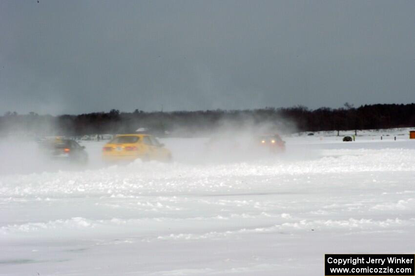 The field heads into turn two under bad whiteout conditions.