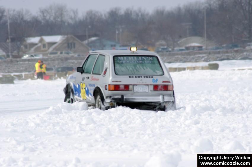 Bucky Weitnauer's VW Rabbit gets caught on the outside of a bank.