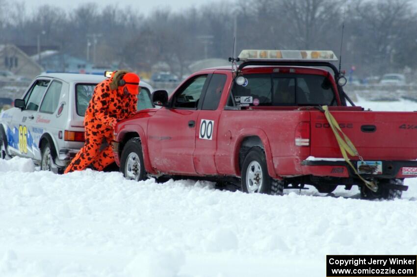 Jim Anderson's Dodge Ram Pickup tries to get the stranded Bucky Weitnauer VW Rabbit off the bank.