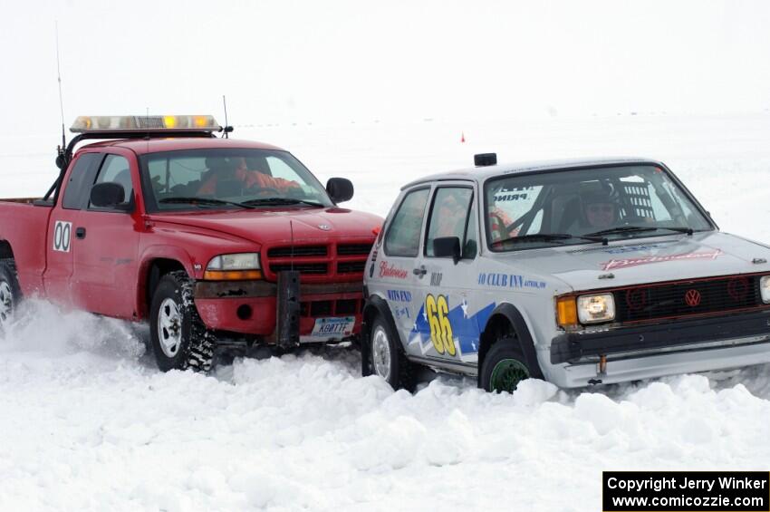 Jim Anderson's Dodge Ram Pickup tries to get the stranded Bucky Weitnauer VW Rabbit off the bank.