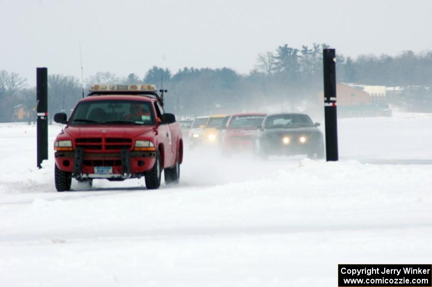 Jim Anderson's Dodge Ram Pickup pulls off the track before the field gets the green again