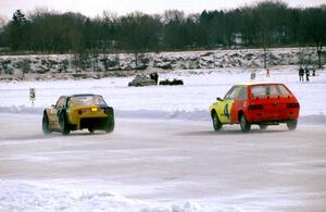 Jim King's Mazda Wankel-powered SAAB Sonnet III and Adam Popp's Dodge Colt go side-by-side entering turn two