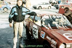 Jerry Winker points to damage after rolling the Dodge Colt he and John Martin shared.