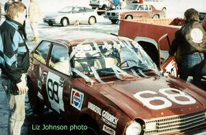 Jerry Winker looks at the damage after rolling the Dodge Colt he and John Martin shared.