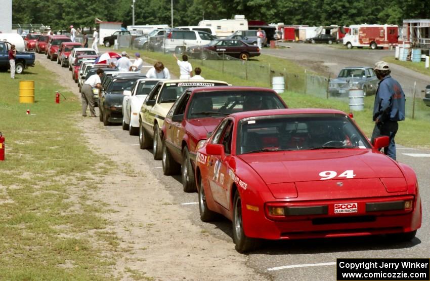 Jim Bryant's ITS Porsche 944, Stu Lenz' SSGT Ford Mustang, Harvey West's Ford Mustang, etc on the false grid.