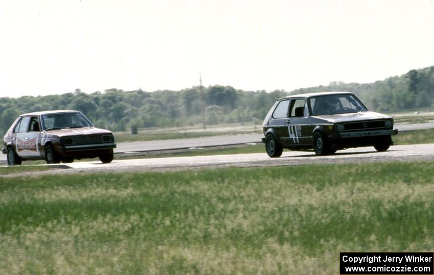 46) Kurt Ristow's ITA VW GTI and 83) Mark Utecht's ITB Dodge Omni