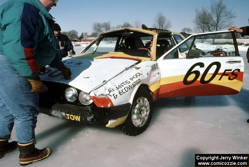 The John Kochevar / Bruce Rosand VW Scirocco after rolling at the end of the front straight.