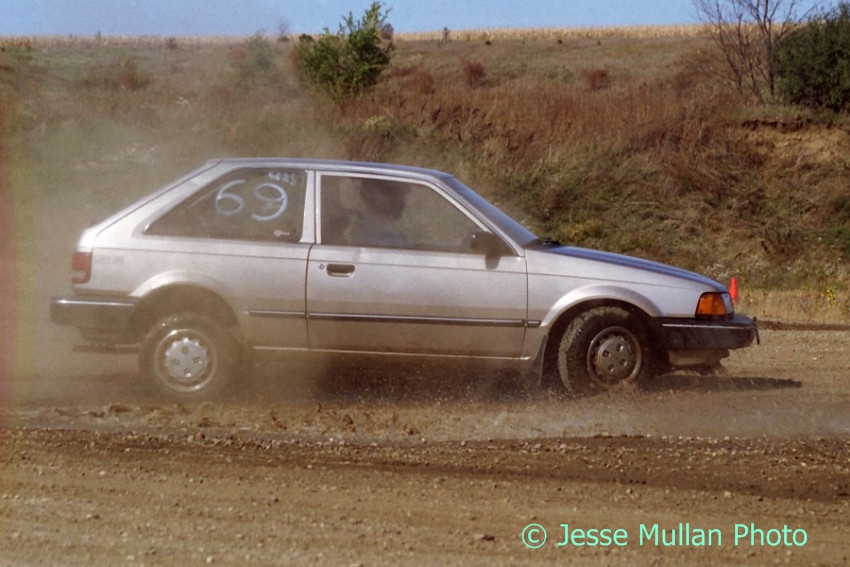 Jerry Winker's Mazda 323SE has a high-speed off (after bottoming out the car in the previous shot).