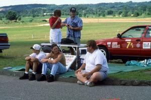 Jon Thompson and Norm Johnson chat on the curb