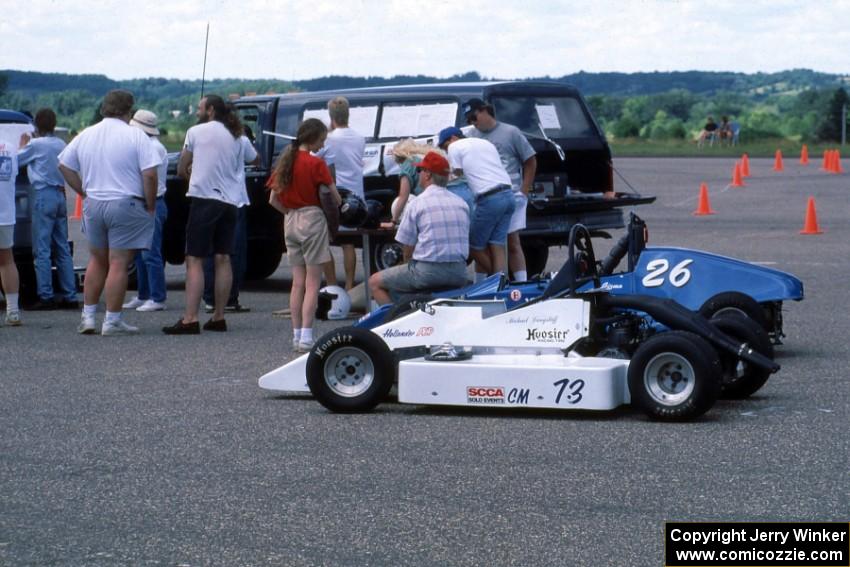 Mike Langstaff's (73) and Mike Skillingstad's (26) Red Devils parked near the scoring area