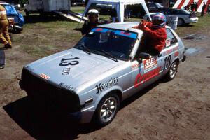 Brittany Creamer and Laurel Strohm pose in Greg Creamer's ITC Toyota Starlet