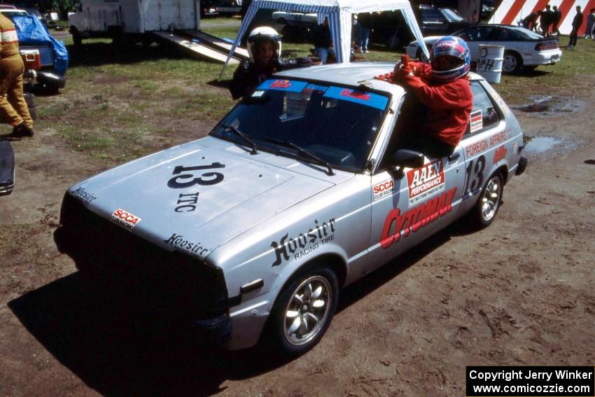 Brittany Creamer and Laurel Strohm pose in Greg Creamer's ITC Toyota Starlet