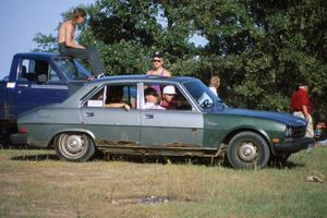 ASCC members hanging out in a ratted-out Peugeot 504
