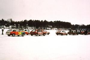 Various cars gridded at the back half of the field