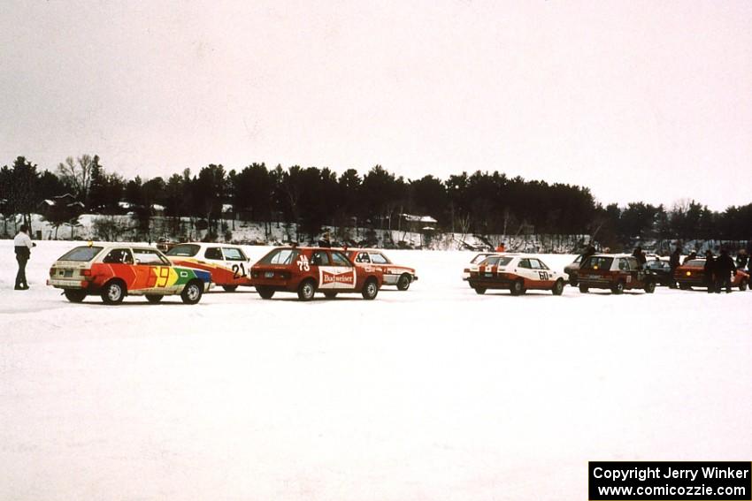 Various cars gridded at the back half of the field