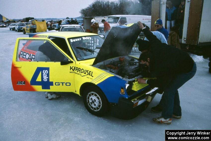 Adam Popp's modified Dodge Colt smoking heavily in the pits
